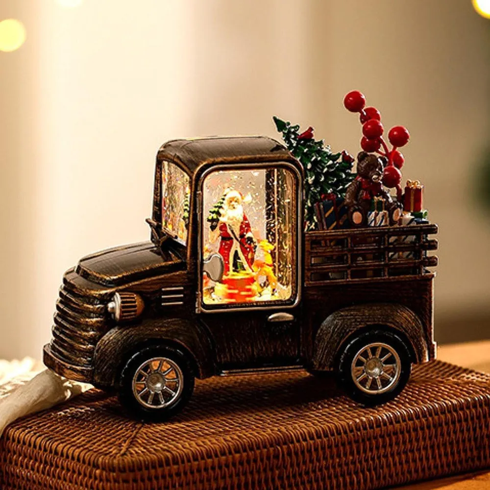 Camión navideño con luces, música y escena de santa claus