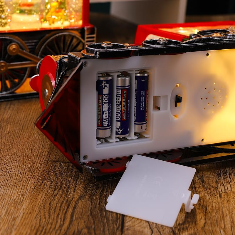 Tren navideño con luces, nieve y escena giratoria de santa claus