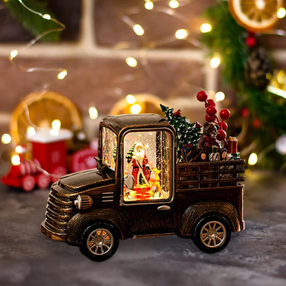 Camión navideño con luces, música y escena de santa claus